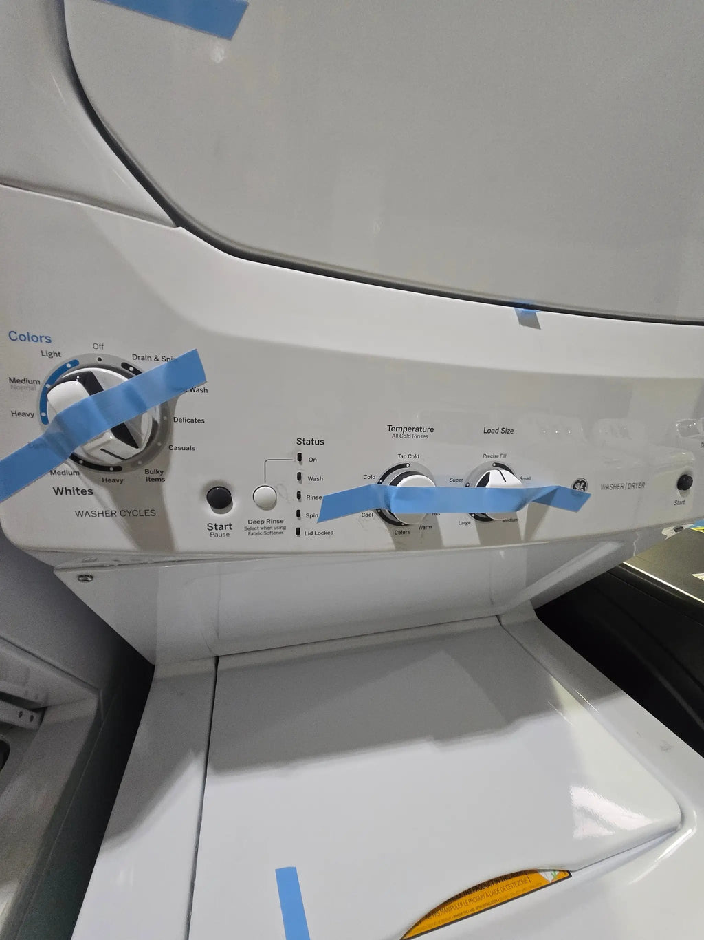 GE Gas Stacked Laundry Center with 3.8-cu ft Top load Washer and 5.9-cu ft Dryer White Model# GUD27GSSMWW by Scratch N Dent Depot