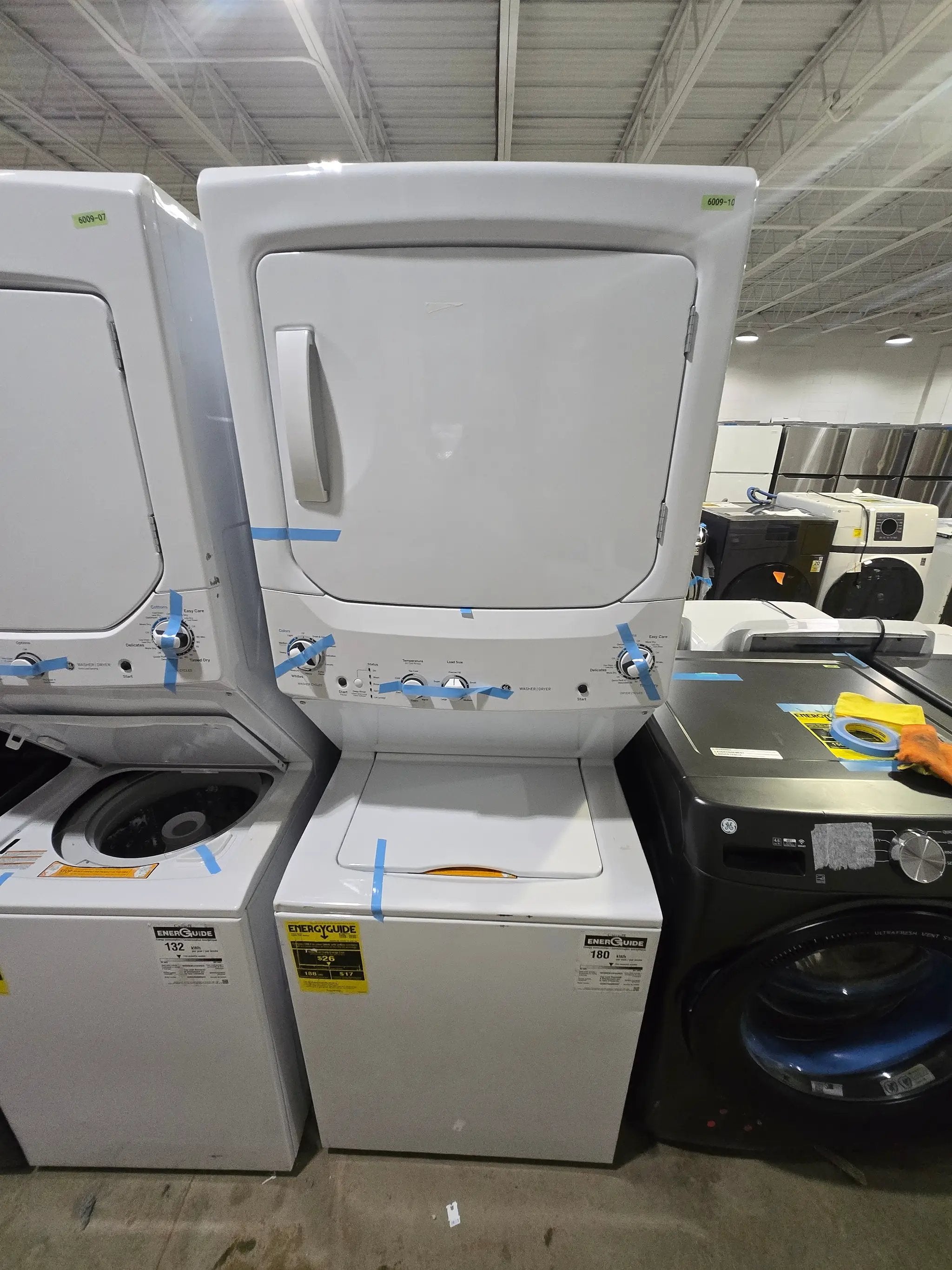 GE Gas Stacked Laundry Center with 3.8-cu ft Top load Washer and 5.9-cu ft Dryer White Model# GUD27GSSMWW by Scratch N Dent Depot